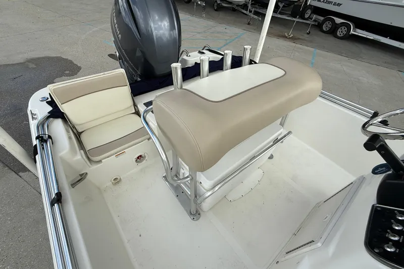 Slide: The Image of 2017 NauticStar 1910 NauticBay boat interior with seating and steering console. - 11