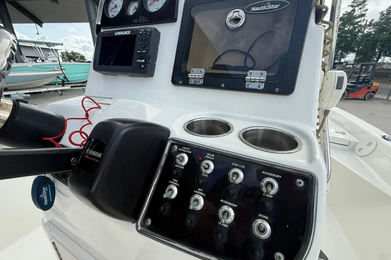 Slide: The Image of 2017 NauticStar 1910 NauticBay boat dashboard with Yamaha controls and Lowrance display. - 14