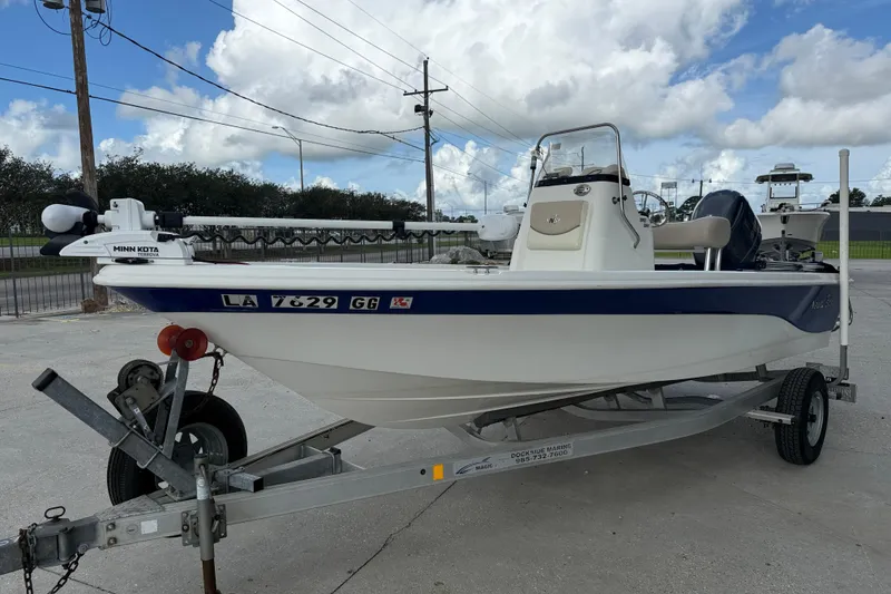 Slide: The Image of 2017 NauticStar 1910 NauticBay boat on trailer, featuring Minn Kota trolling motor. - 3