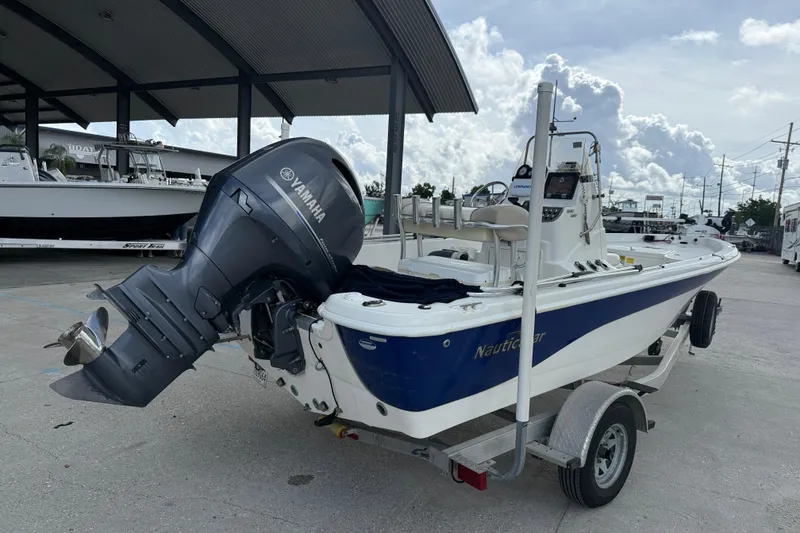 Slide: The Image of 2017 NauticStar 1910 NauticBay boat with Yamaha outboard motor on trailer. - 6