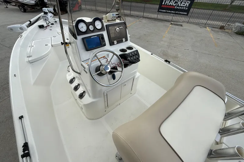 Slide: The Image of 2017 NauticStar 1910 NauticBay boat interior with steering console and seating. - 8