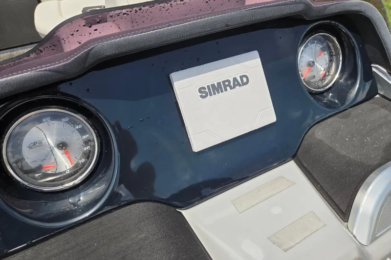 Slide: The Image of Dashboard of 2020 Godfrey AquaPatio 235 UL with Simrad display and gauges. - 10