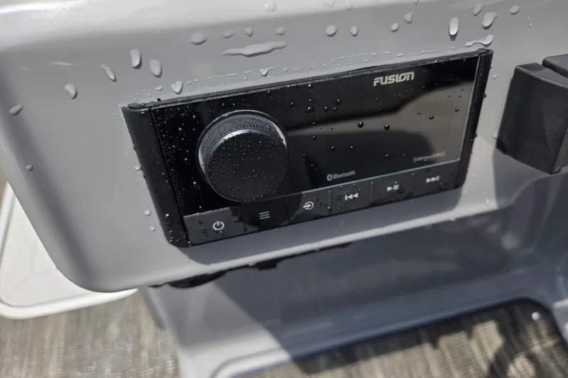 Slide: The Image of Water droplets on Fusion Bluetooth stereo in 2020 Godfrey AquaPatio 235 UL boat. - 11