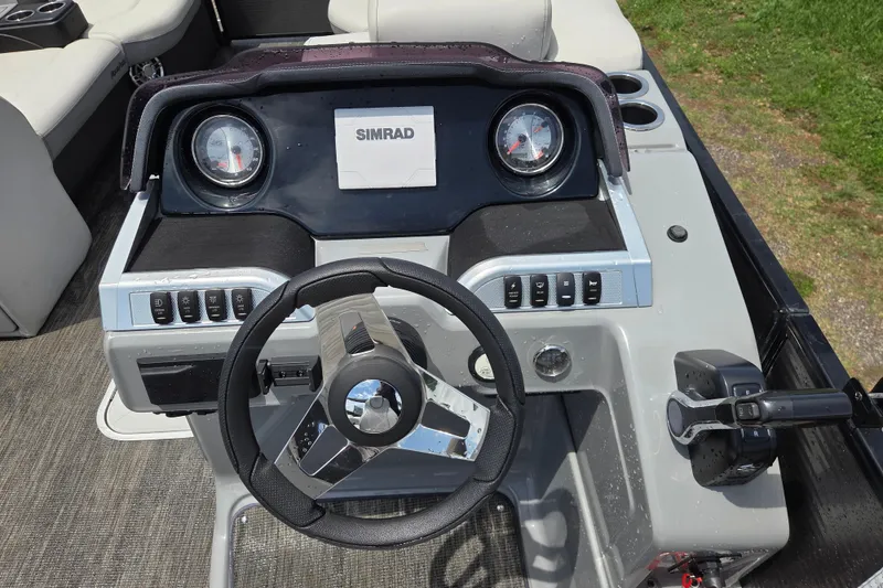 Slide: The Image of Steering console of 2020 Godfrey AquaPatio 235 UL with Simrad display and controls. - 12