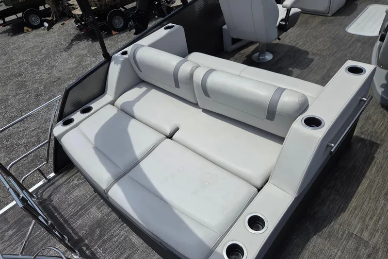 Slide: The Image of Luxurious seating on 2020 Godfrey AquaPatio 235 UL pontoon boat with cup holders. - 14