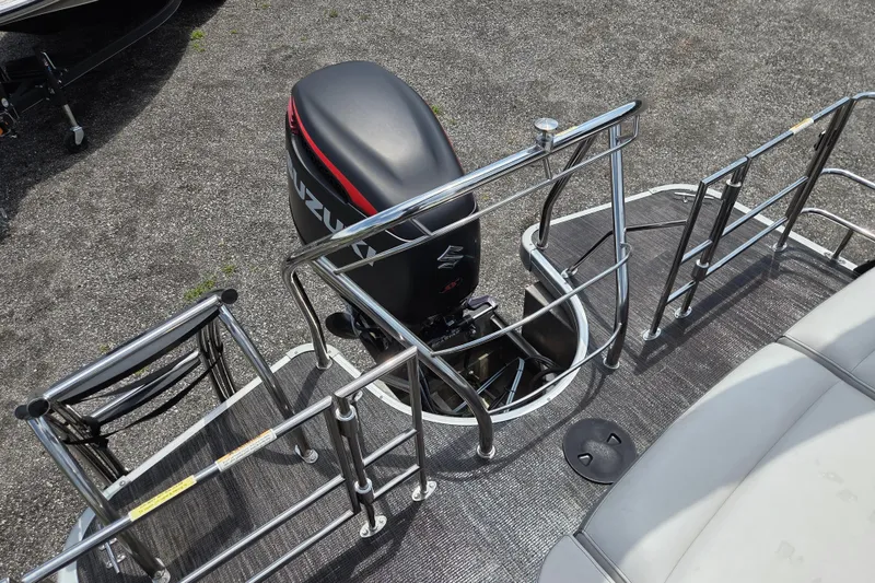 Slide: The Image of 2020 Godfrey AquaPatio 235 UL pontoon boat with Suzuki outboard motor and stainless steel railings. - 15