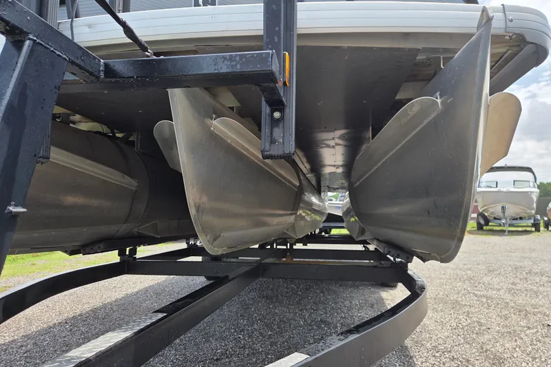 Slide: The Image of Underneath view of a 2020 Godfrey AquaPatio 235 UL pontoon boat on a trailer. - 2