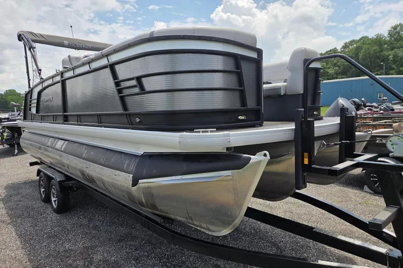 Slide: The Image of 2020 Godfrey AquaPatio 235 UL pontoon boat on trailer, parked outdoors. - 3