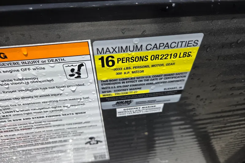 Slide: The Image of Capacity label on 2020 Godfrey AquaPatio 235 UL, max 16 persons or 2219 lbs. - 9