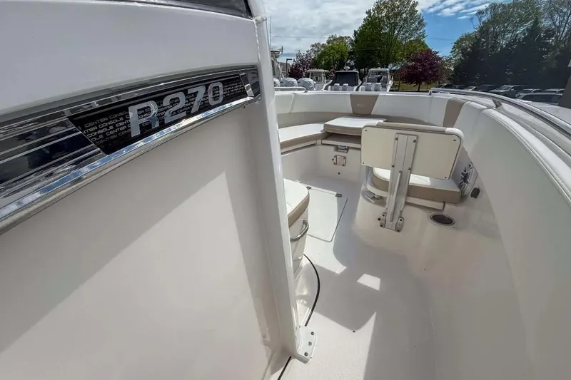 Slide: The Image of 2025 Robalo R270 Center Console boat interior with seating and sleek design. - 10