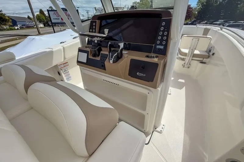 Slide: The Image of 2025 Robalo R270 Center Console boat interior with modern dashboard and seating. - 11