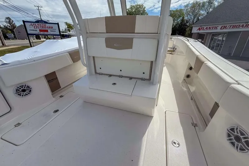 Slide: The Image of 2025 Robalo R270 Center Console boat interior with seating and storage, displayed at Atlantic Outboard. - 12