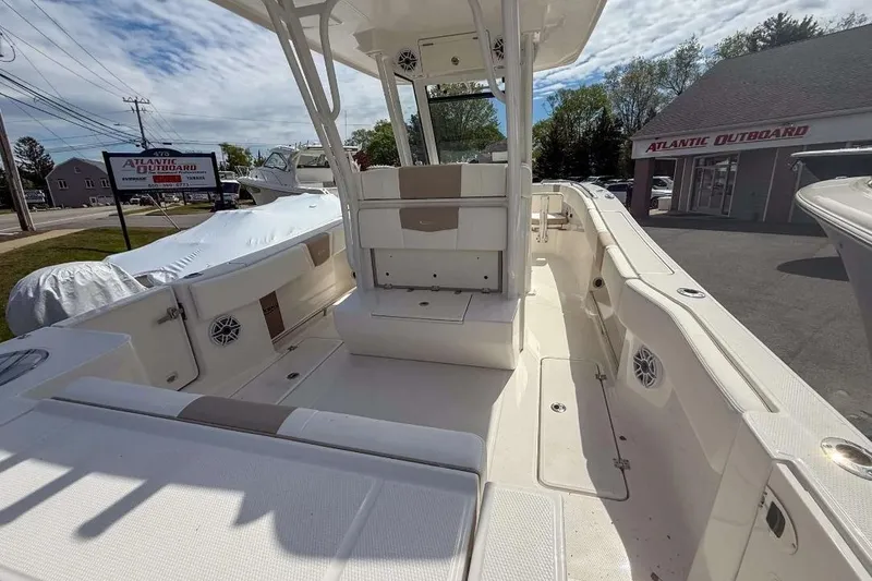 Slide: The Image of 2025 Robalo R270 Center Console boat interior at Atlantic Outboard dealership. - 13