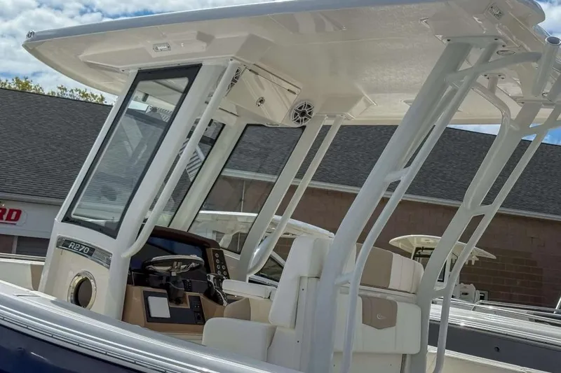 Slide: The Image of 2025 Robalo R270 Center Console boat with modern helm and seating. - 15