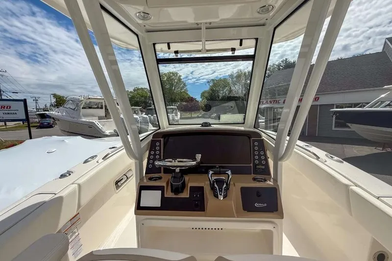 Slide: The Image of 2025 Robalo R270 Center Console boat interior with modern dashboard and controls. - 3