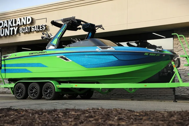 The Image of 2022 Centurion Ri265 boat in vibrant green and blue at Oakland County Boat Sales. - 0