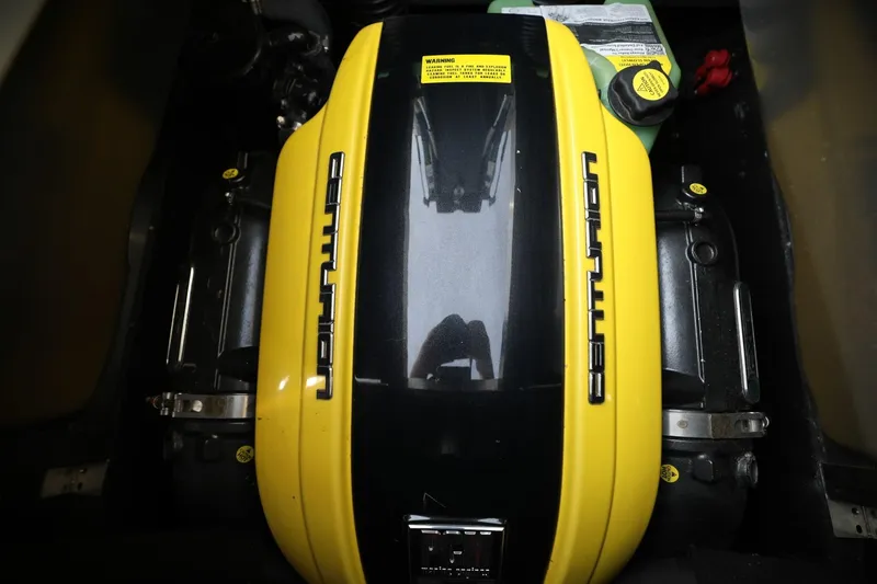 Slide: The Image of 2022 Centurion Ri265 engine with yellow cover and branding. - 14