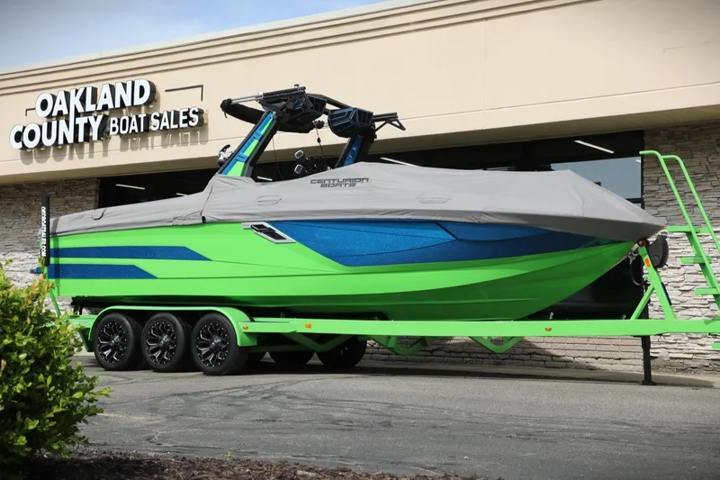 Slide: The Image of 2022 Centurion Ri265 boat in vibrant green and blue at Oakland County Boat Sales. - 15