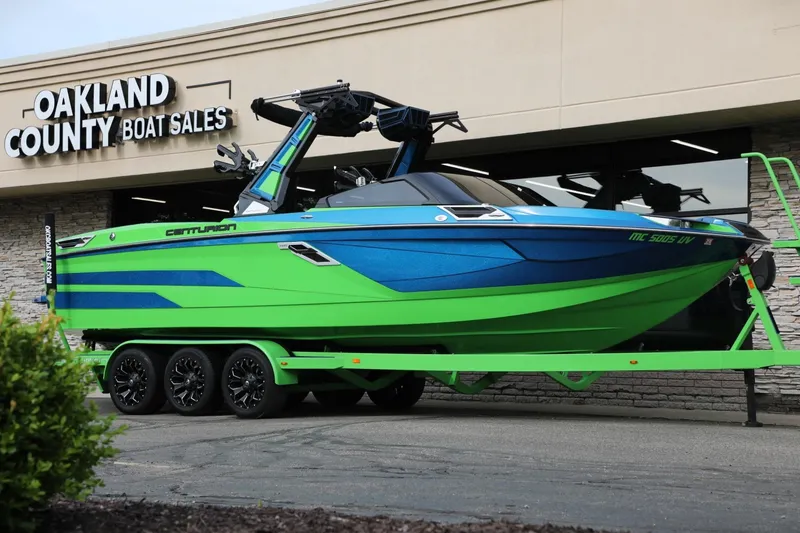 Slide: The Image of 2022 Centurion Ri265 boat in vibrant blue and green at Oakland County Boat Sales. - 17