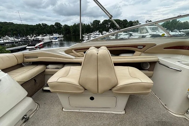 Slide: The Image of Interior of a 2000 Sea Ray 230 Overnighter boat with beige seating. - 15