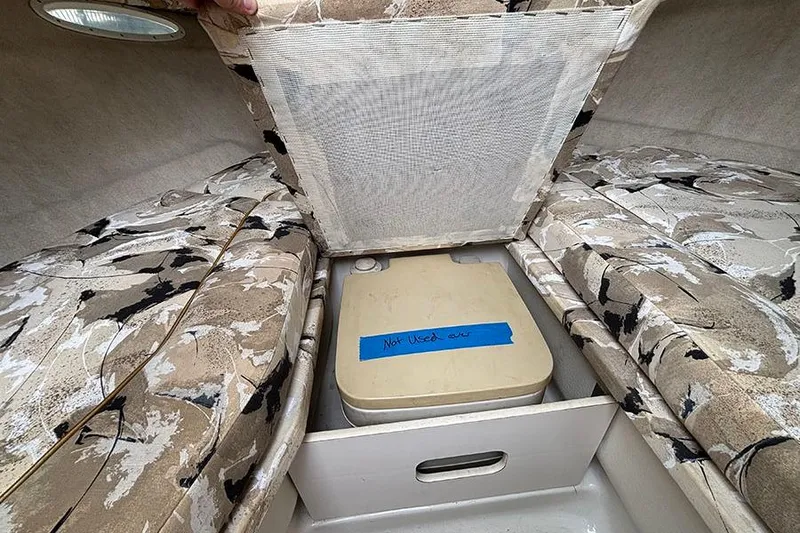 Slide: The Image of Interior of 2000 Sea Ray 230 Overnighter with hidden storage compartment. - 22