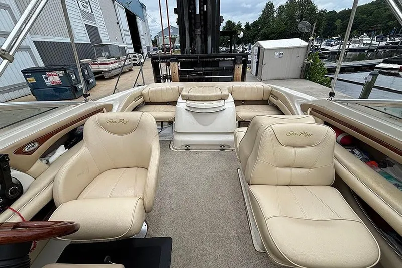 Slide: The Image of Interior of a 2000 Sea Ray 230 Overnighter boat with beige seating. - 23