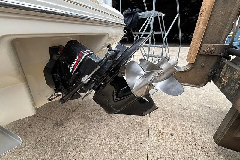 Slide: The Image of Outboard motor of 2000 Sea Ray 230 Overnighter boat on a trailer. - 6