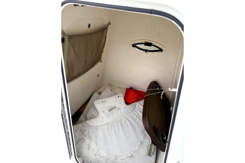 Slide: The Image of Interior cabin of 2016 Sailfish 270 CC boat with storage and seating. - 7