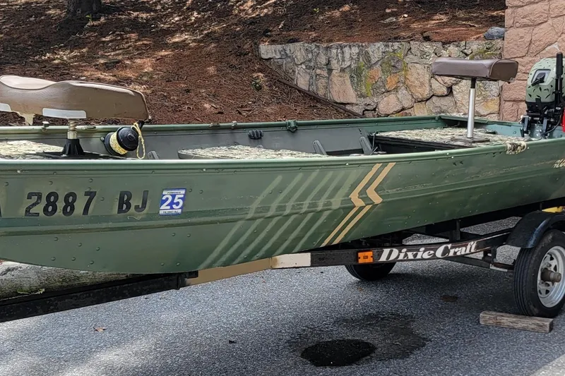 Slide: The Image of 1994 Alumacraft 1436 Jon boat on trailer, green with registration number 2887 BJ. - 9