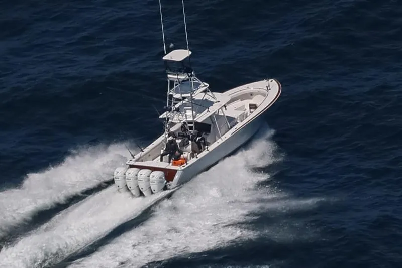 Slide: The Image of 2022 Valhalla Boatworks V-41 cruising on open water, showcasing powerful engines. - 1