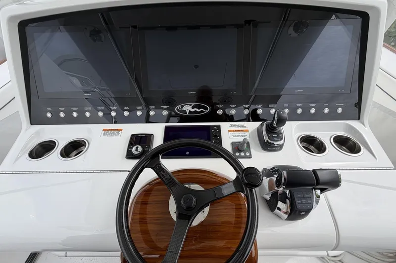 Slide: The Image of 2022 Valhalla Boatworks V-41 helm with advanced navigation displays and controls. - 13