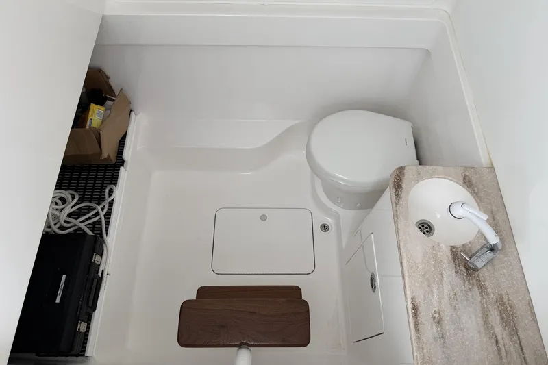 Slide: The Image of 2022 Valhalla Boatworks V-41 bathroom with toilet, sink, and storage. - 17