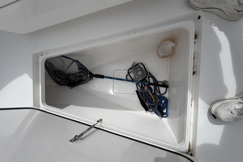 Slide: The Image of Storage compartment on 2022 Valhalla Boatworks V-41 with fishing net and rope. - 25