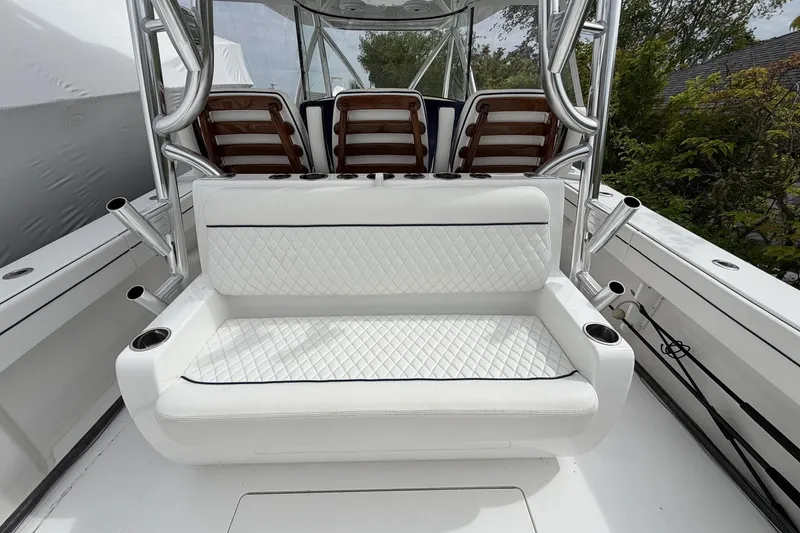 Slide: The Image of 2022 Valhalla Boatworks V-41 interior with white quilted seating and rod holders. - 26