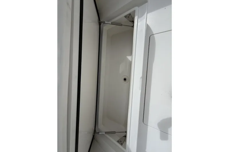 Slide: The Image of 2022 Valhalla Boatworks V-41 storage compartment with hydraulic hinges and drain. - 28