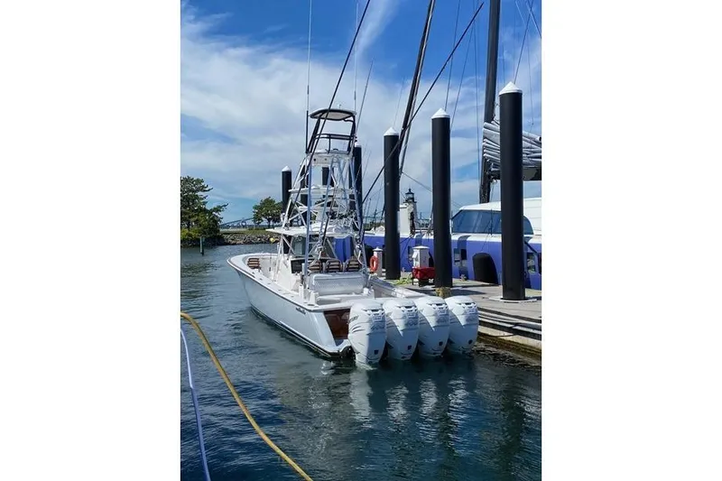 Slide: The Image of 2022 Valhalla Boatworks V-41 docked, featuring four powerful outboard engines. - 3