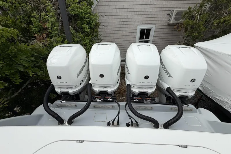 Slide: The Image of Four Mercury outboard engines on a 2022 Valhalla Boatworks V-41. - 32