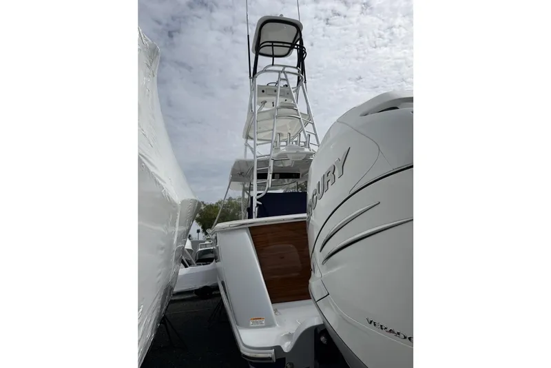 Slide: The Image of 2022 Valhalla Boatworks V-41 with Mercury engine, viewed from the rear under cloudy skies. - 7