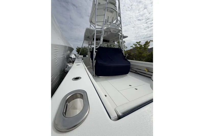 Slide: The Image of 2022 Valhalla Boatworks V-41 deck with seating and tower under cloudy sky. - 8