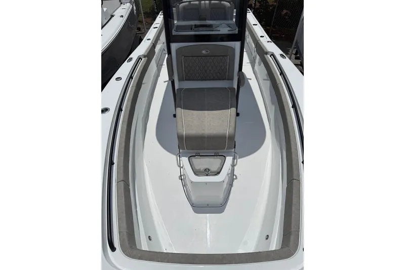 Slide: The Image of 2026 Sea Hunt Gamefish 27 Coffin Box boat interior with cushioned seating and sleek design. - 12