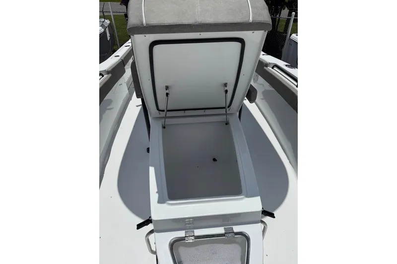 Slide: The Image of Open coffin box on 2026 Sea Hunt Gamefish 27 boat, showcasing spacious storage. - 13