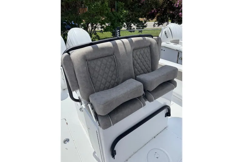Slide: The Image of 2026 Sea Hunt Gamefish 27 Coffin Box boat seats with gray upholstery and diamond stitching. - 14