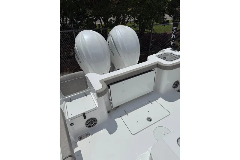 Slide: The Image of 2026 Sea Hunt Gamefish 27 Coffin Box boat with dual Yamaha engines, spacious deck layout. - 16