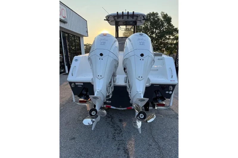 Slide: The Image of 2026 Sea Hunt Gamefish 27 Coffin Box with dual outboard engines, rear view. - 2