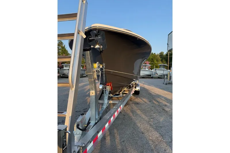 Slide: The Image of 2026 Sea Hunt Gamefish 27 Coffin Box boat on trailer, parked outdoors. - 4