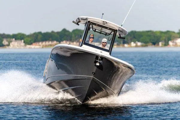 Slide: The Image of Manufacturer Provided Image: 2026 Sea Hunt Gamefish 27 Coffin Box cruising on water, showcasing sleek design and performance. - 6