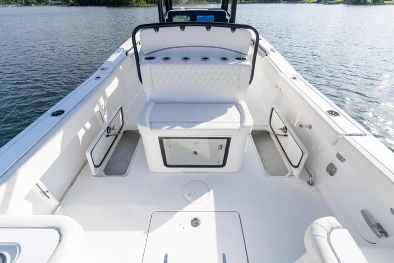 Slide: The Image of Manufacturer Provided Image: 2026 Sea Hunt Gamefish 27 Coffin Box boat interior, featuring spacious seating and storage compartments. - 9