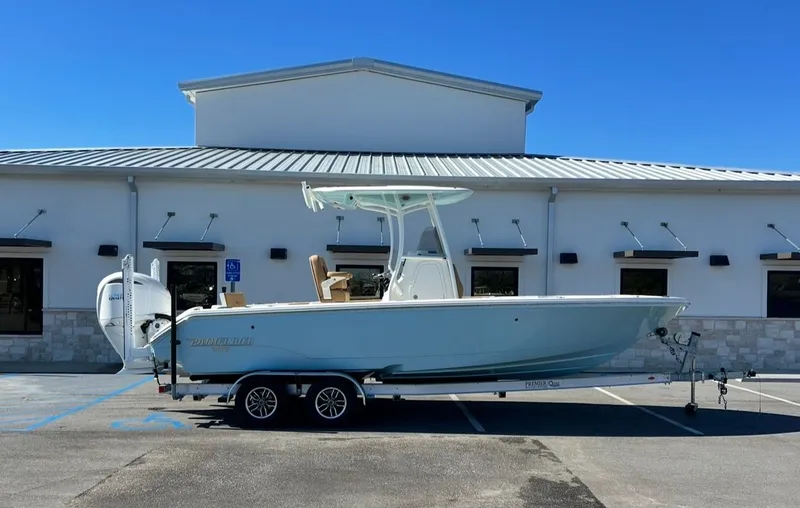 The Image of 2026 Pathfinder 2400 TRS boat on trailer in front of building. - 1
