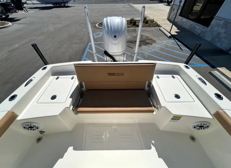 Slide: The Image of Pathfinder 2400 TRS 2026 boat rear with bench seat and motor. - 12
