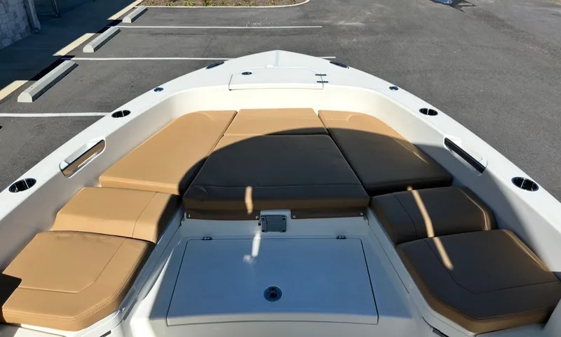 Slide: The Image of 2026 Pathfinder 2400 TRS with beige cushions on the bow deck. - 15